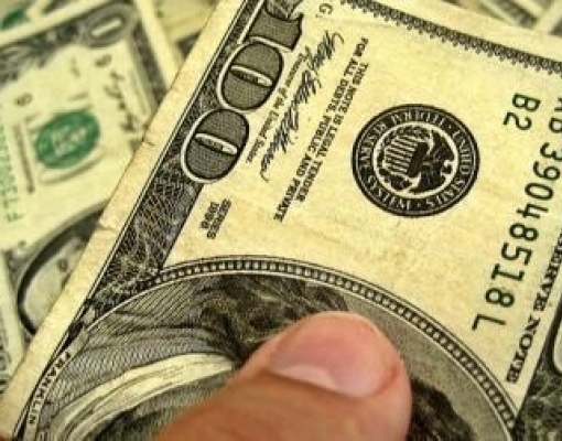 Dólar cai frente ao real antes de apresentação de Previdência ao Congresso 