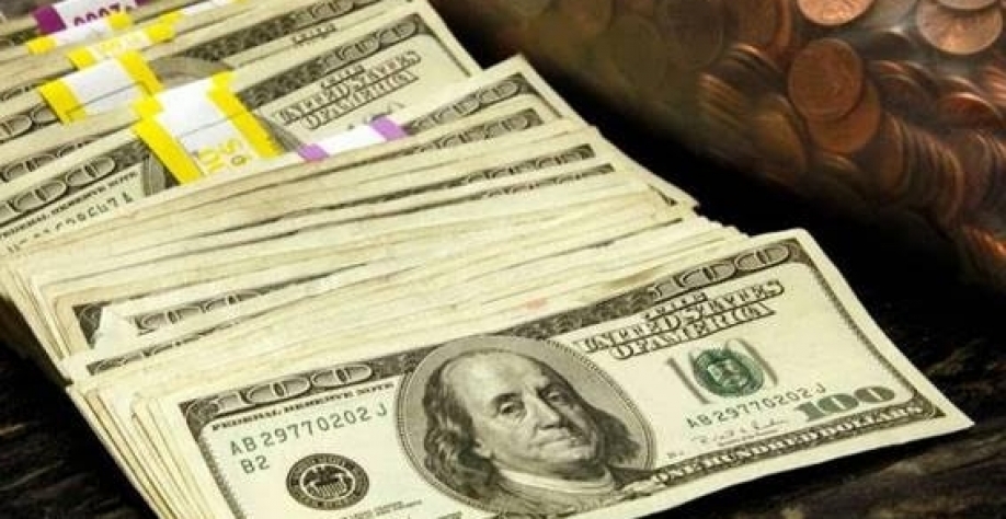 Cédulas e moedas de dólares em cofre em um banco em Westminster, Colorado, EUA - Rick Wilking - 3.nov.2009/Reuters